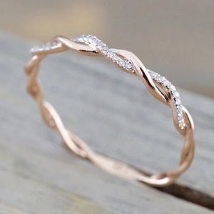 Ladies Rose tone twisted design band with crystal